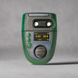 the Analox Aspida CO2 and O2 gas detector, a compact handheld device with a rugged black and green casing. The front display shows real-time gas level readings for carbon dioxide (CO2) and oxygen (O2), with large, clear digital indicators. The detector has control buttons beneath the screen and a protective rubberized exterior for durability in various environments. Designed for personal safety in industrial or confined space settings.