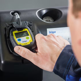 H2S PAC 6000 single gas detector being placed into a docking station